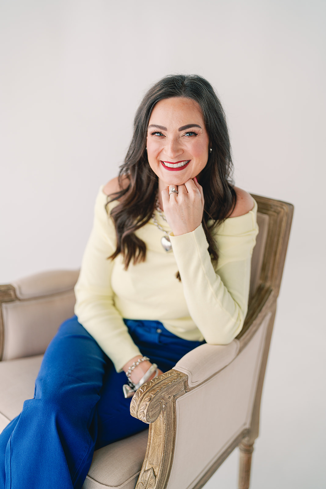 Lisa, RN, BSN, seated in an armchair